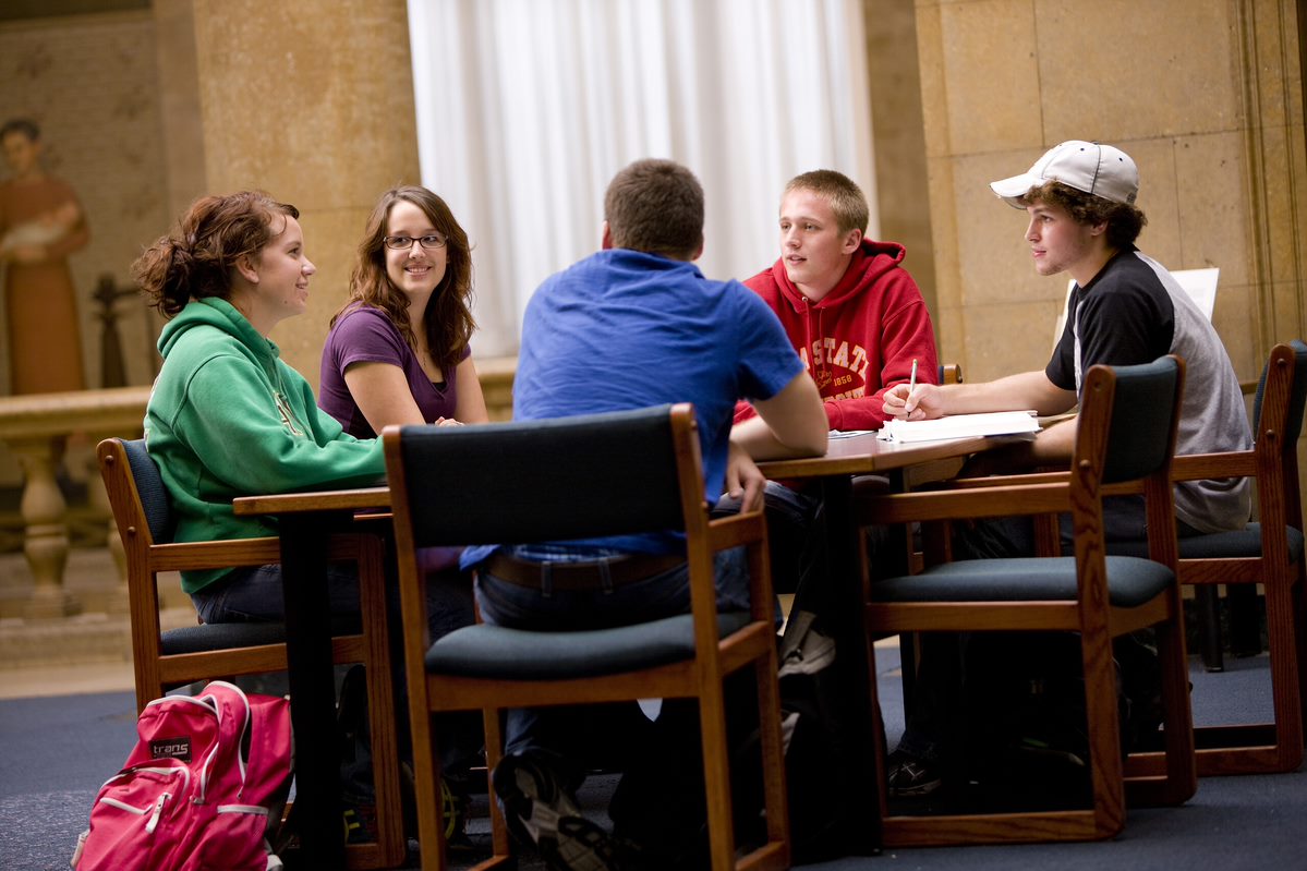 Students sitting at a table having a conversation