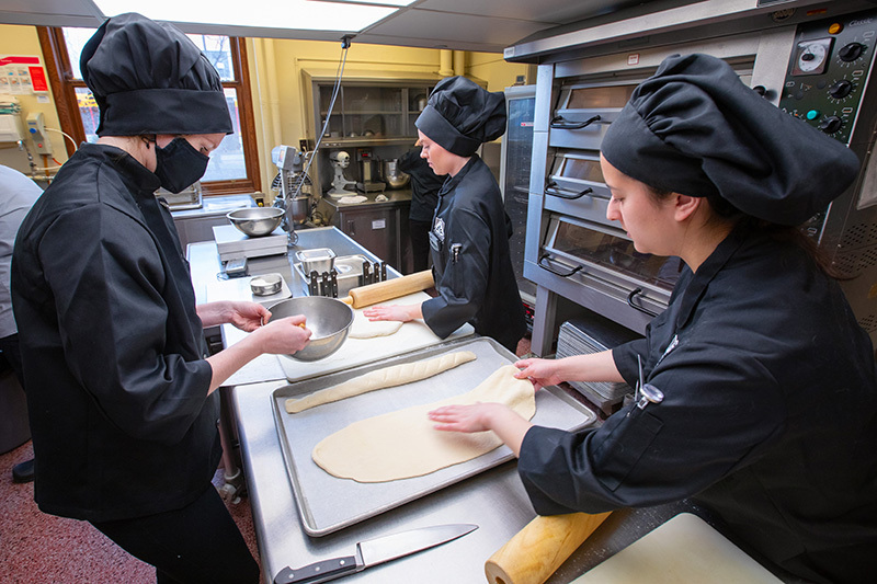 Students working in the Tea Room kitchen