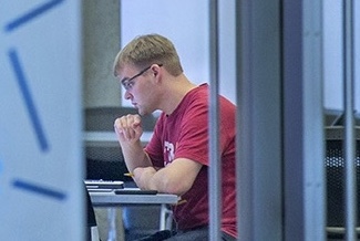 Student studying in Hach Hall
